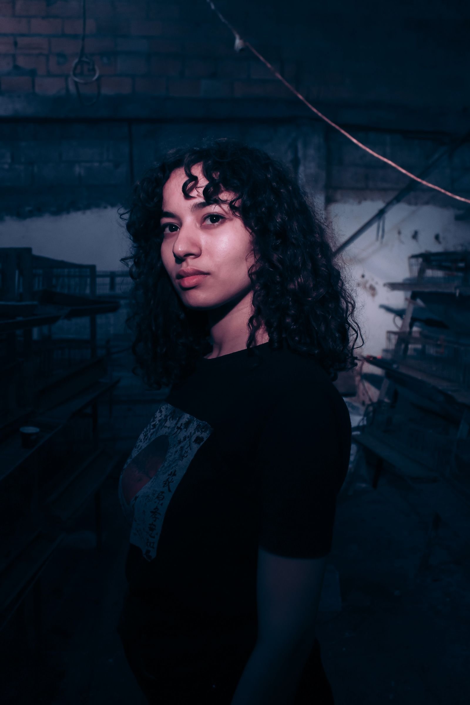 Atmospheric portrait with a grunge-era mood and low light